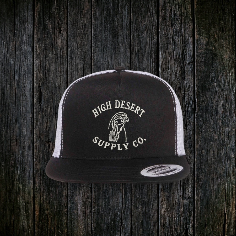 Chukar Logo Flat Brim Black/White front - real embroidered logo, dark wood style