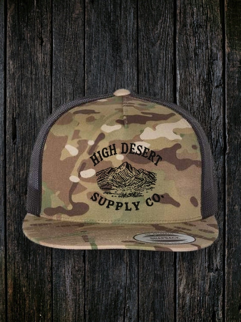 Mountains Logo Flat Brim Multicam Green/Black front - dark wood style, black-speckle defect removed below SUPPLY CO.